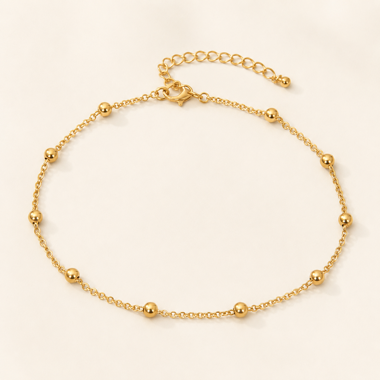 Goldene Fußkette mit Kugeln