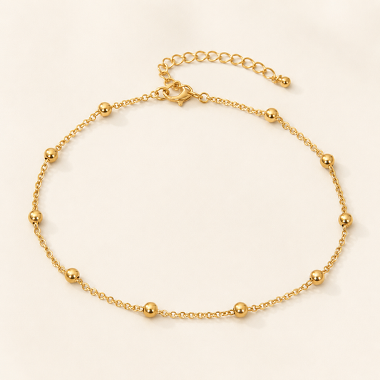 Goldene Fußkette mit Kugeln